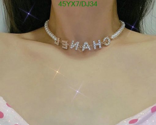 Woman wearing a custom sparkly name necklace.