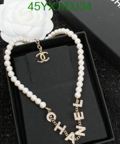 Chanel pearl necklace with logo letters on display box.