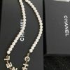 Chanel pearl necklace with logo on black box