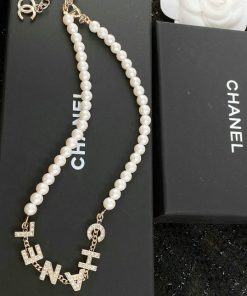 Chanel pearl necklace with logo on black box