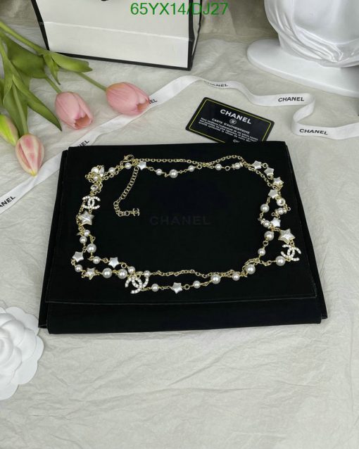 Pearl and crystal necklace on display with floral backdrop