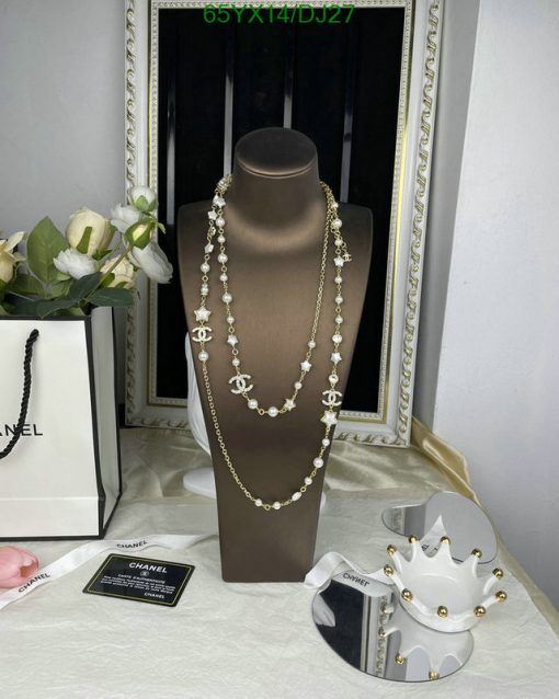 Elegant pearl and gold necklace display with accessories.