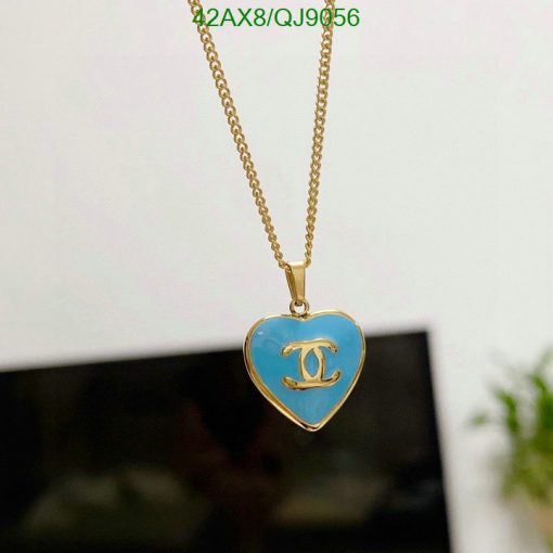 Gold chain with blue heart pendant.