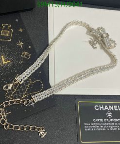 Chanel crystal bow necklace with authenticity card displayed.