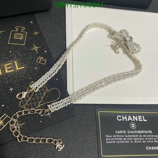 Chanel crystal bow necklace with authenticity card displayed.