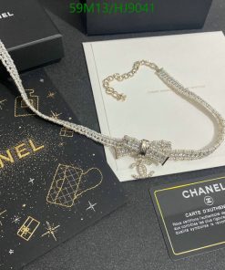 Chanel necklace with authenticity certificate on display