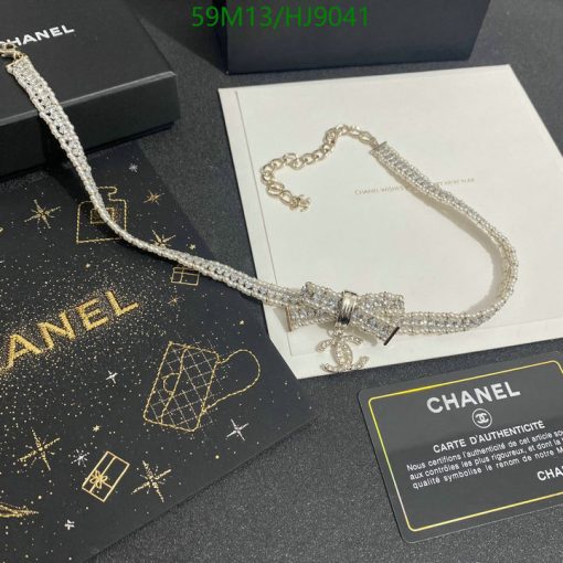 Chanel necklace with authenticity certificate on display