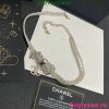 Chanel branded sparkling bow bracelet on presentation box.