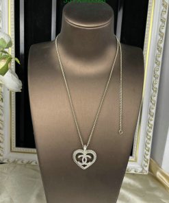 Heart pendant necklace on mannequin display.