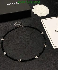 Designer black beaded necklace with logo and packaging.