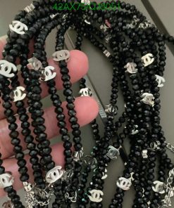 Black beaded necklaces with silver charms.