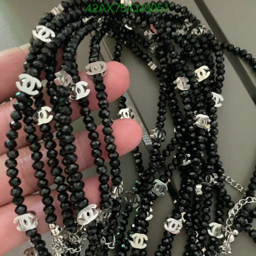 Black beaded necklaces with silver charms.