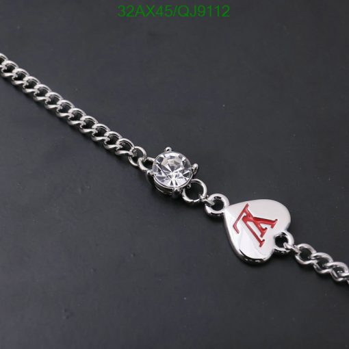 Silver bracelet with diamond charm and engraved heart.