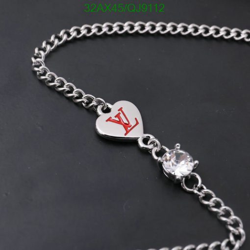 Silver heart pendant necklace with crystal detail.