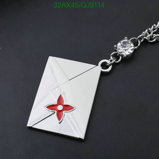 Silver envelope pendant with red flower and crystal.