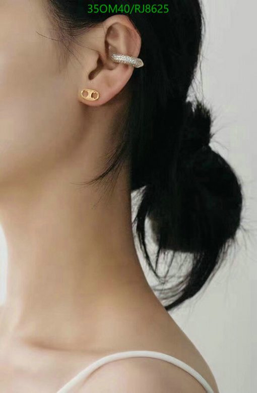 Woman with elegant earrings and updo hairstyle.