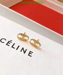 Gold designer logo earrings on display box