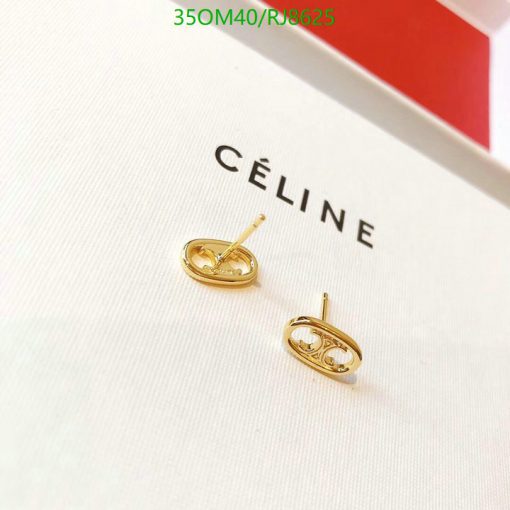 Gold designer logo earrings on white background.