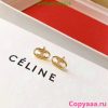 Celine gold knot earrings on brand box