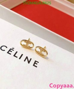 Celine gold knot earrings on brand box