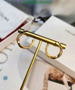 Gold designer glasses on fashion magazine.