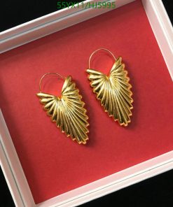 Gold leaf design earrings in white box.