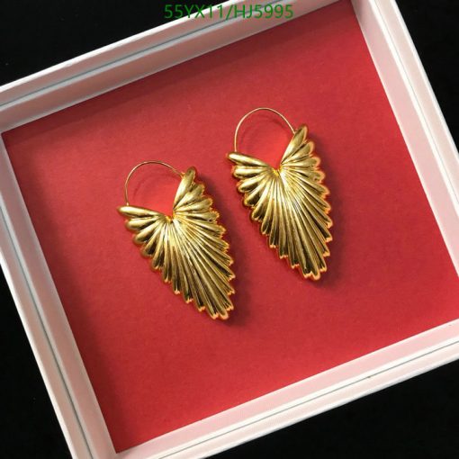 Gold leaf design earrings in white box.