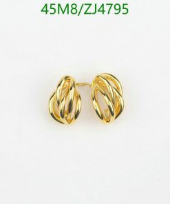 Gold twisted hoop earrings on white background.