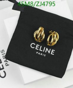 Gold hoop earrings on brand pouch and box.