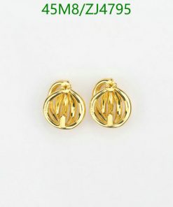 Gold ribbed ball earrings on white.