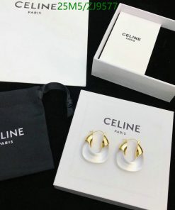 Celine Paris branded packaging and white gold hoop earrings.