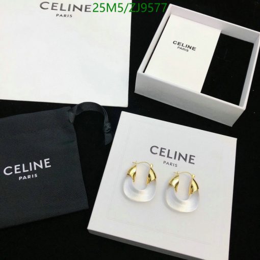 Celine Paris branded packaging and white gold hoop earrings.