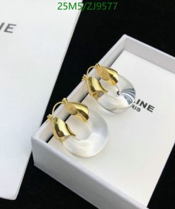 Gold and silver hoop earrings in white box.