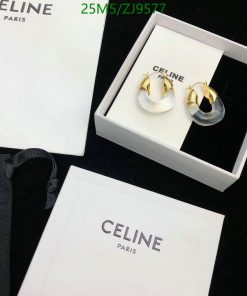 Celine Paris branded earrings with packaging.