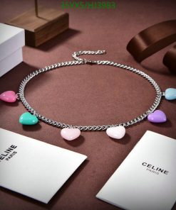 Silver heart charm necklace on display with branded packaging.