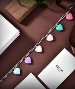 Multicolored heart charms on silver necklace with elegant packaging.