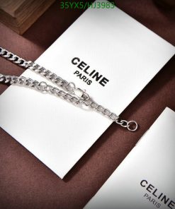 Silver chain necklace on branded card luxury fashion accessory.