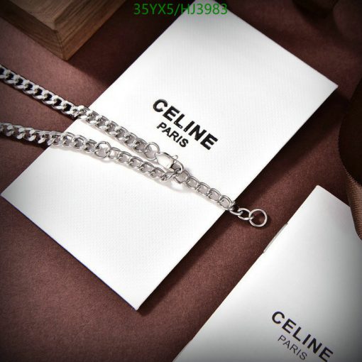 Silver chain necklace on branded card luxury fashion accessory.