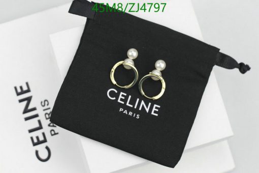 Celine pearl earrings on black pouch with logo