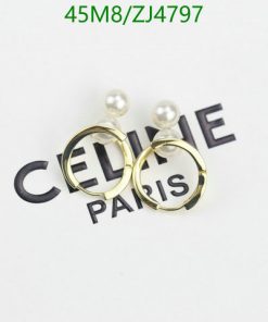 Designer pearl earrings on branded tag.