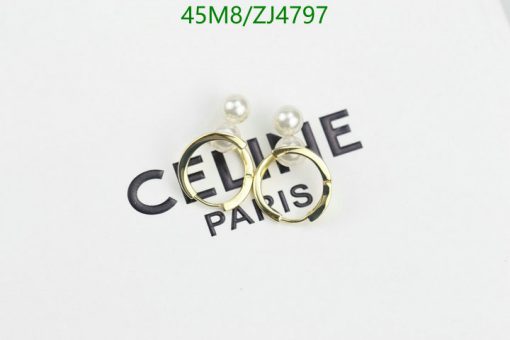 Designer pearl earrings on branded tag.