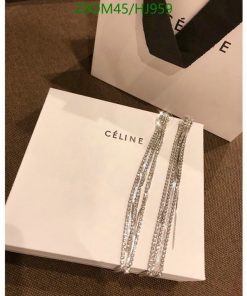 Celine brand box with sparkly jewelry on top.