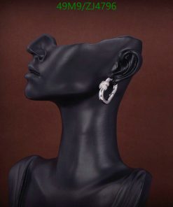 Mannequin head showcasing stylish earring.