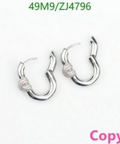 Silver hoop earrings with decorative beads.