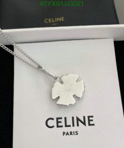 Silver Celine pendant necklace on white display.