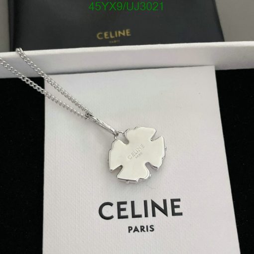 Silver Celine pendant necklace on white display.