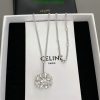 Celine Paris silver necklace with gemstone pendant displayed.