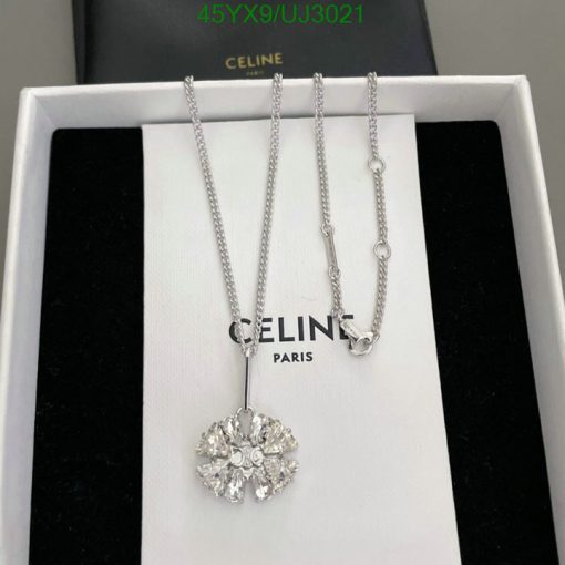 Celine Paris silver necklace with gemstone pendant displayed.