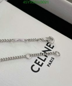 Celine silver chain bracelet on white display.