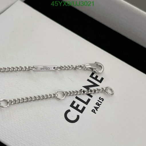 Celine silver chain bracelet on white display.